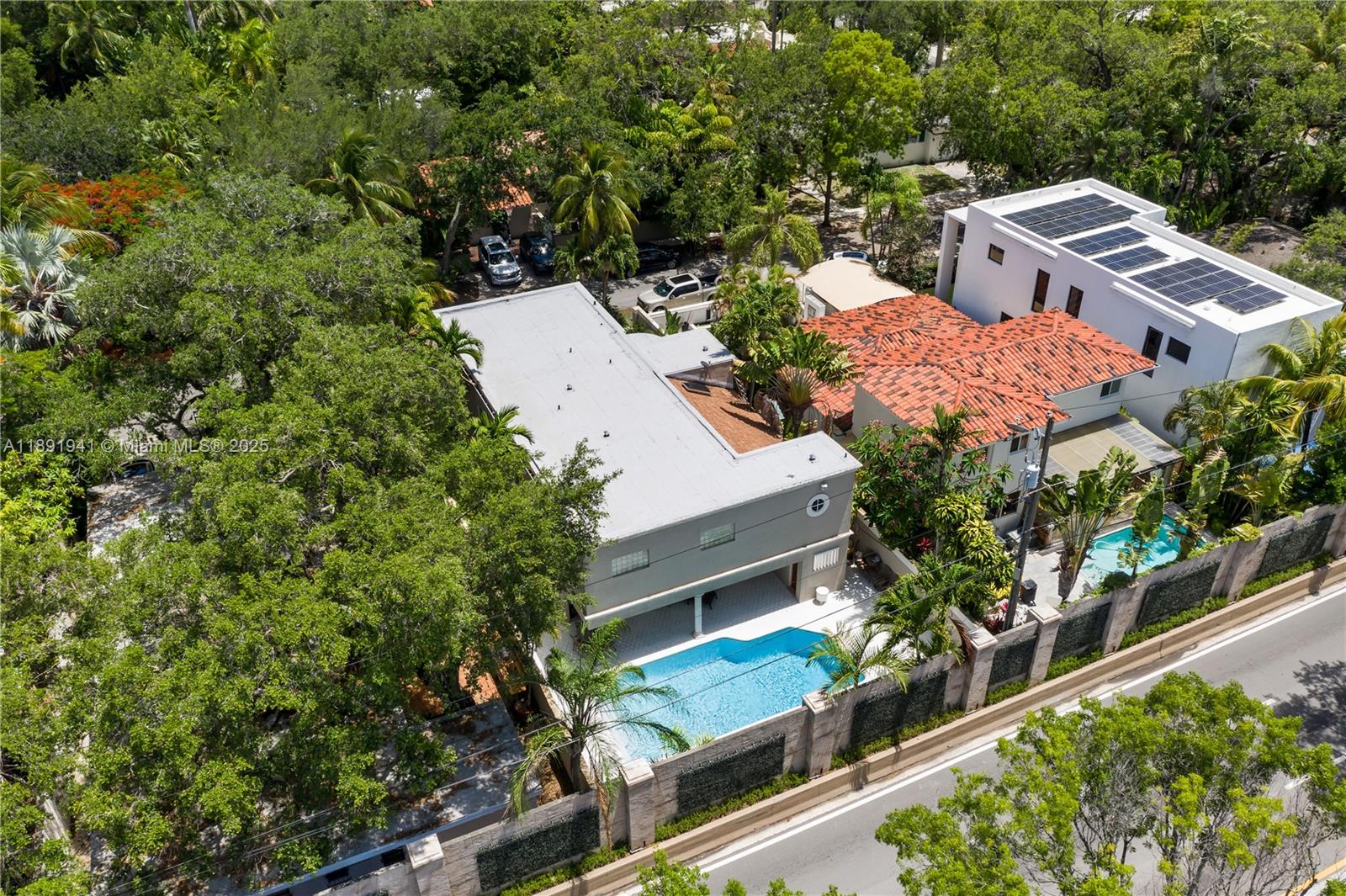 1769 Wa Kee Na Drive Miami, FL 33133 - Photo 20 of 21 an aerial view of residential house with outdoor space and trees around