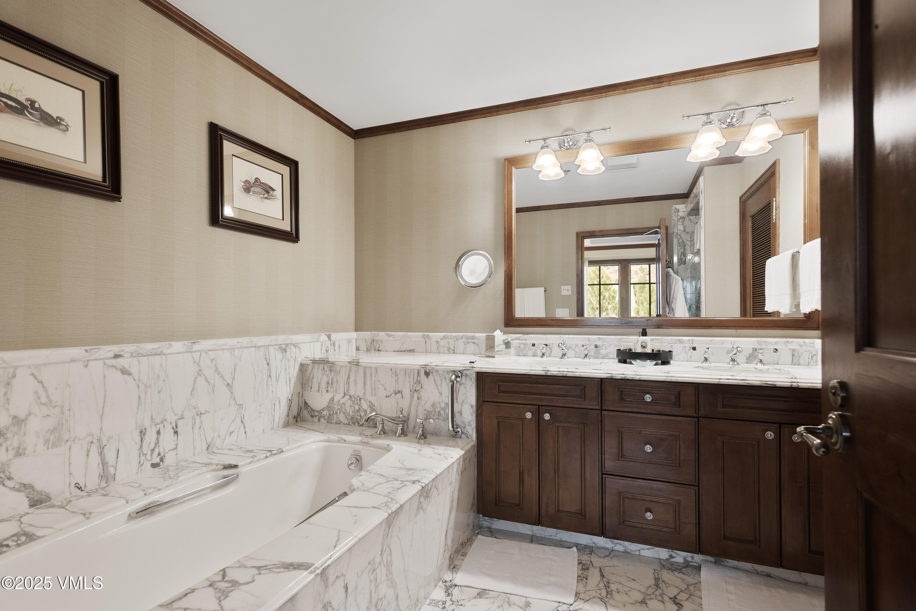75 Prospector Road, Unit 840216 Aspen, CO 81611 - Photo 13 of 27 a bathroom with a tub a double vanity sink and a mirror