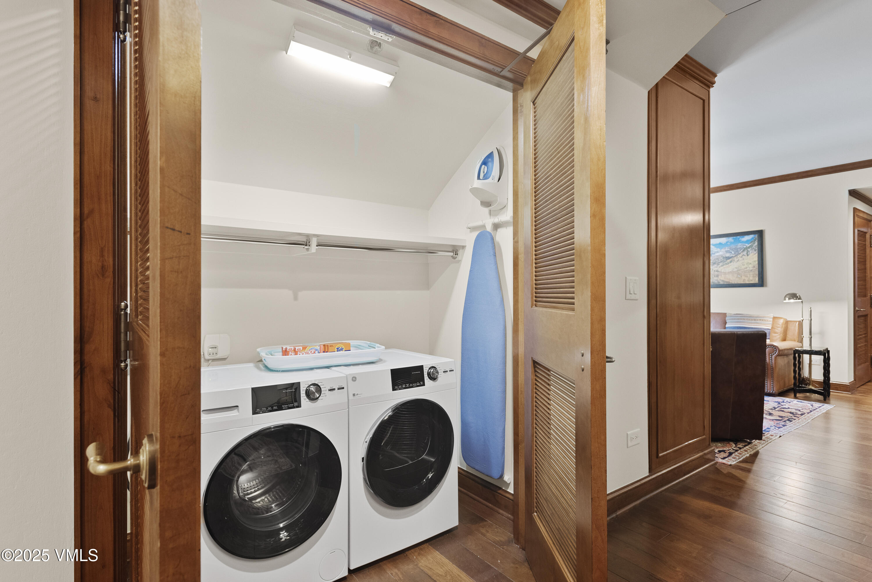 75 Prospector Road, Unit 840216 Aspen, CO 81611 - Photo 8 of 27 a view of a hallway with washer and dryer