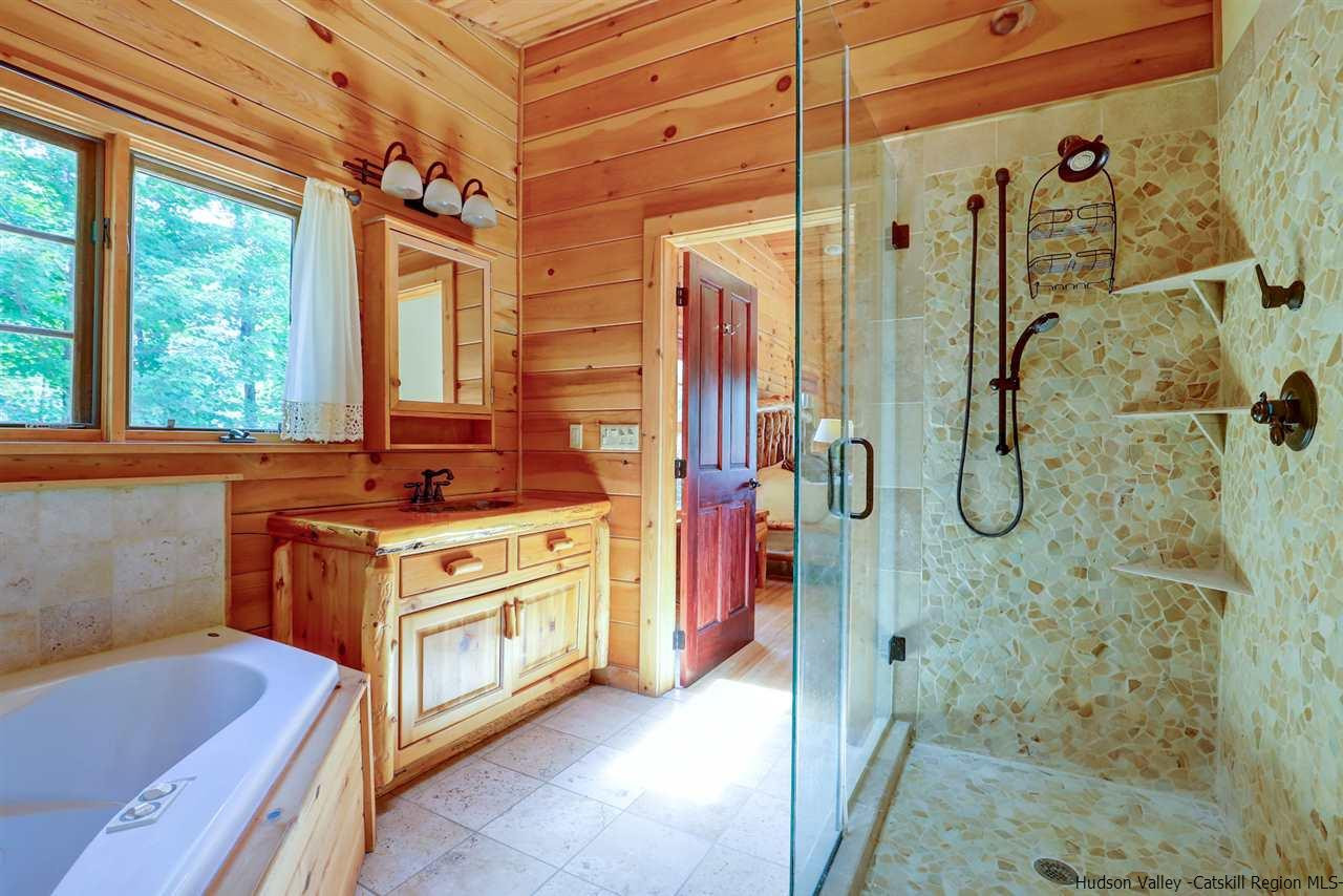 401 Cold Brook Road Bearsville, NY 12409 - Photo 11 of 35 a bathroom with a tub sink and mirror