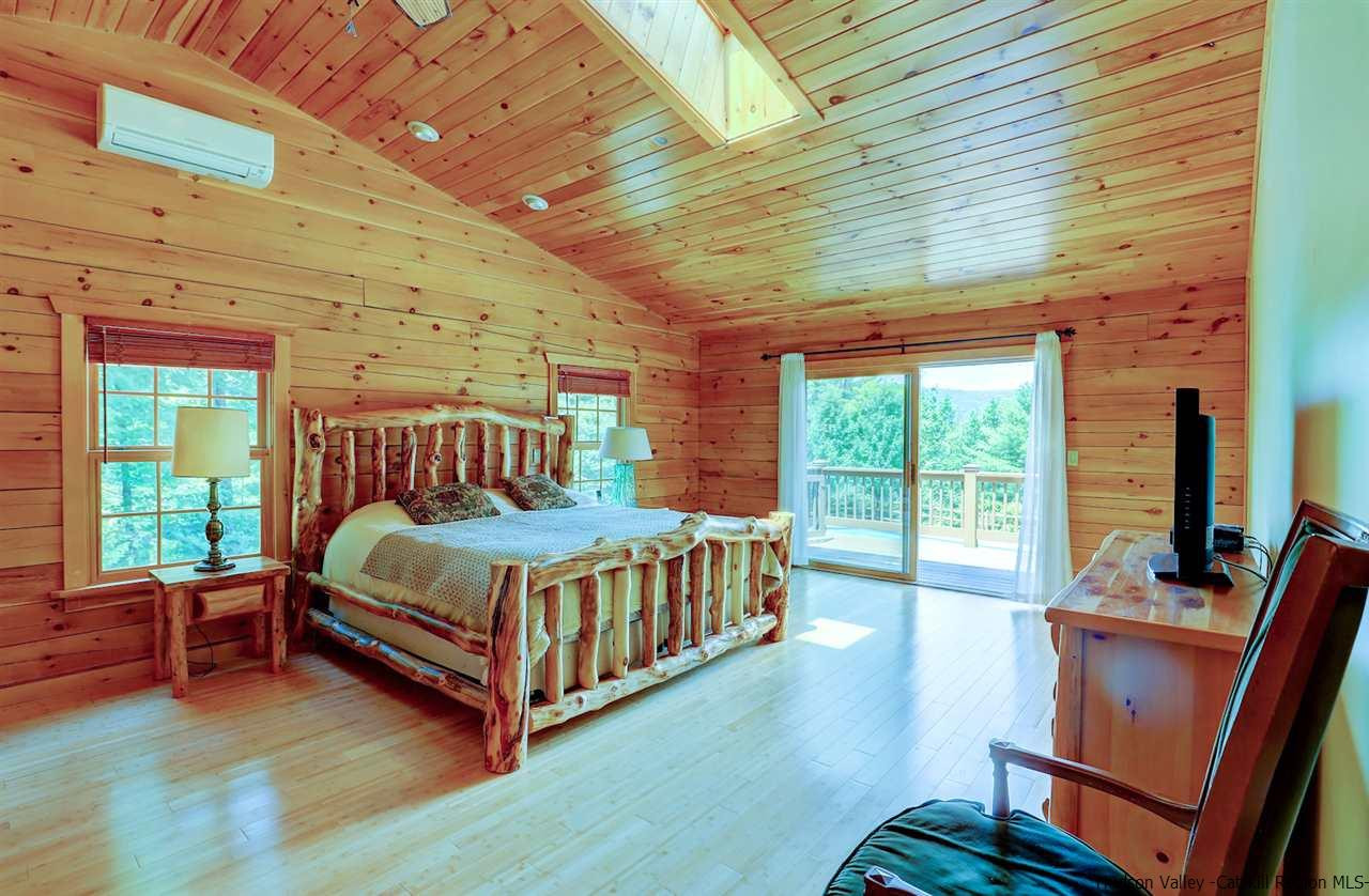 401 Cold Brook Road Bearsville, NY 12409 - Photo 12 of 35 a bedroom with a bed and a desk