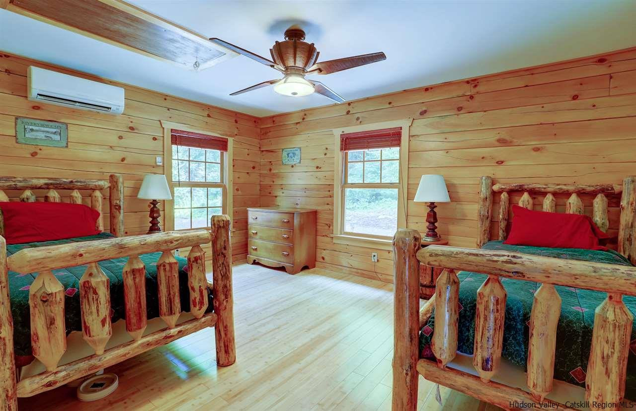 401 Cold Brook Road Bearsville, NY 12409 - Photo 16 of 35 a bedroom with furniture and wooden floor