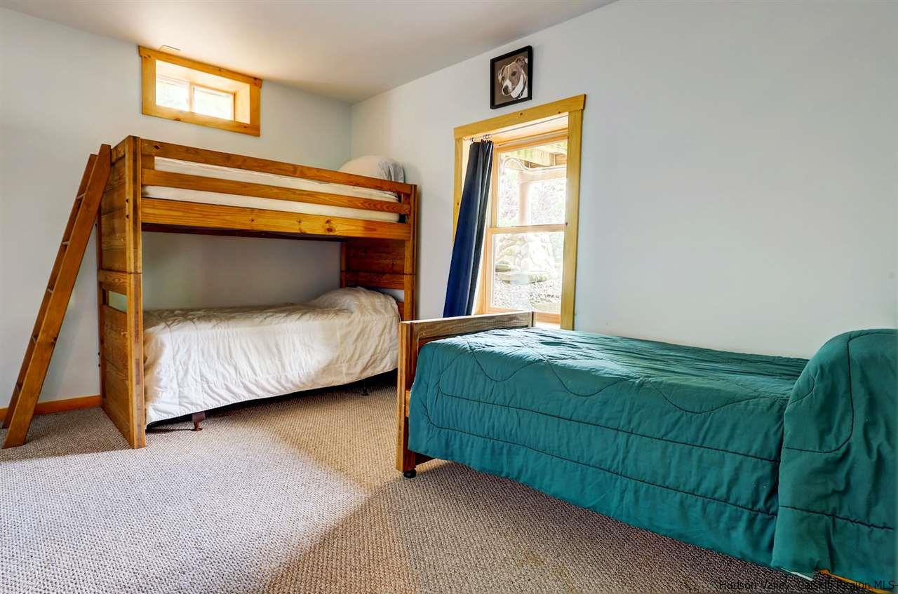 401 Cold Brook Road Bearsville, NY 12409 - Photo 23 of 35 a bedroom with a bed and a window