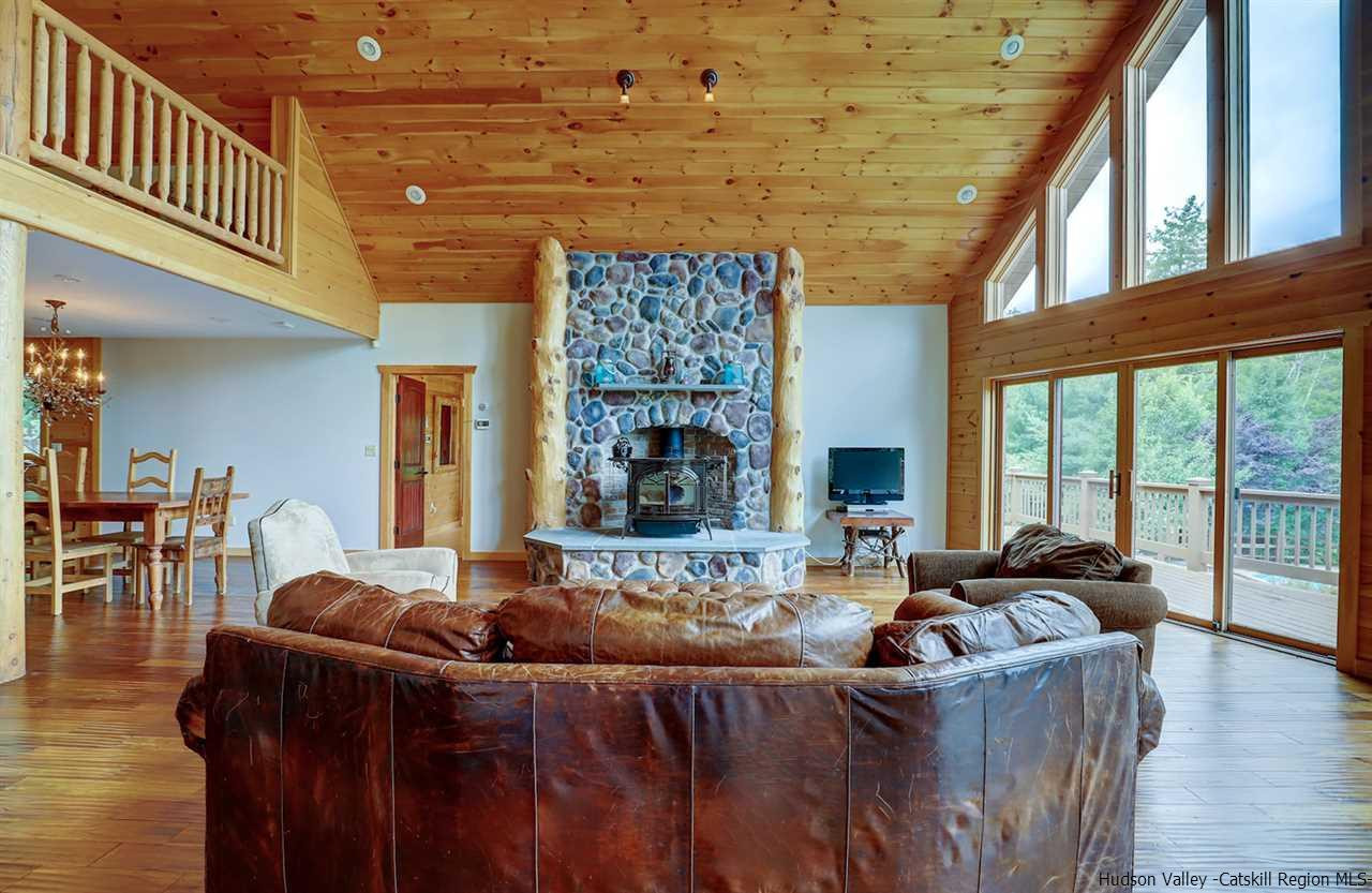401 Cold Brook Road Bearsville, NY 12409 - Photo 5 of 35 a living room with furniture and a fireplace