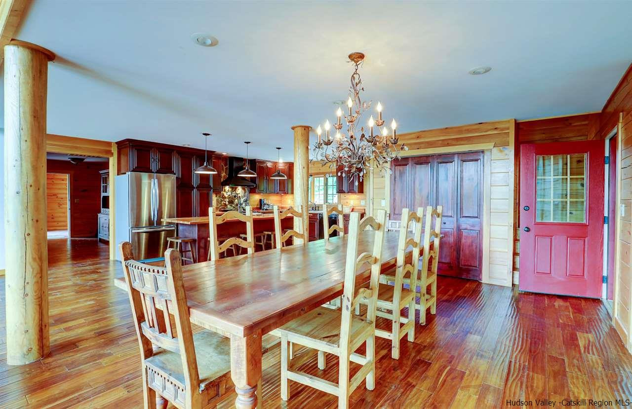 401 Cold Brook Road Bearsville, NY 12409 - Photo 9 of 35 a view of a dining room with furniture and wooden floor