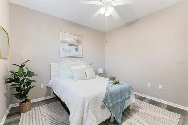 a view of a room with wooden floor and a window