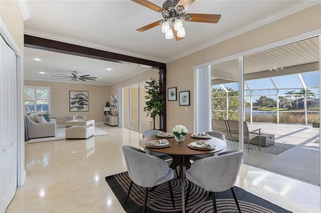 a bathroom with a granite countertop sink a toilet a mirror a vanity and shower