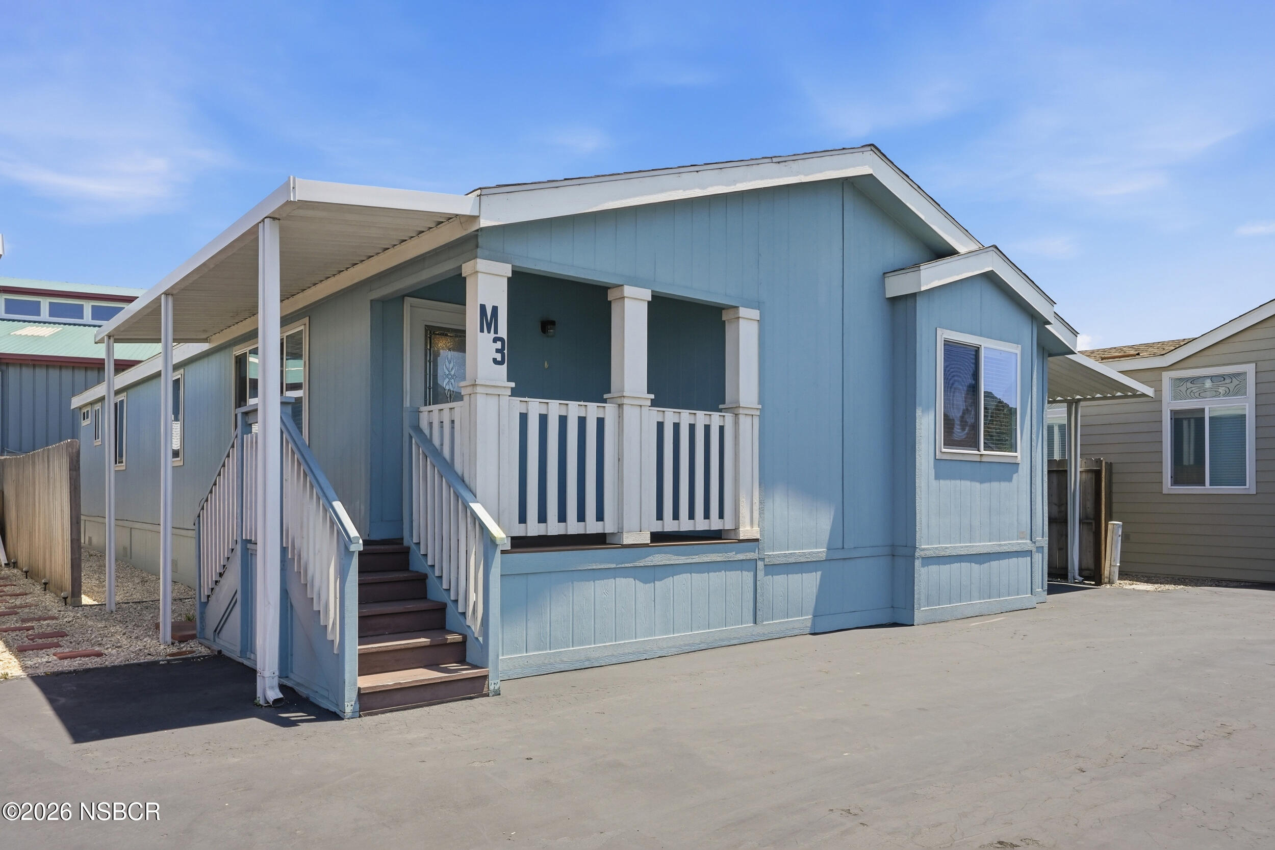 500 Atascadero Road, Unit M3 Morro Bay, CA 93442 - Photo 2 of 29 a yellow house with a outdoor space