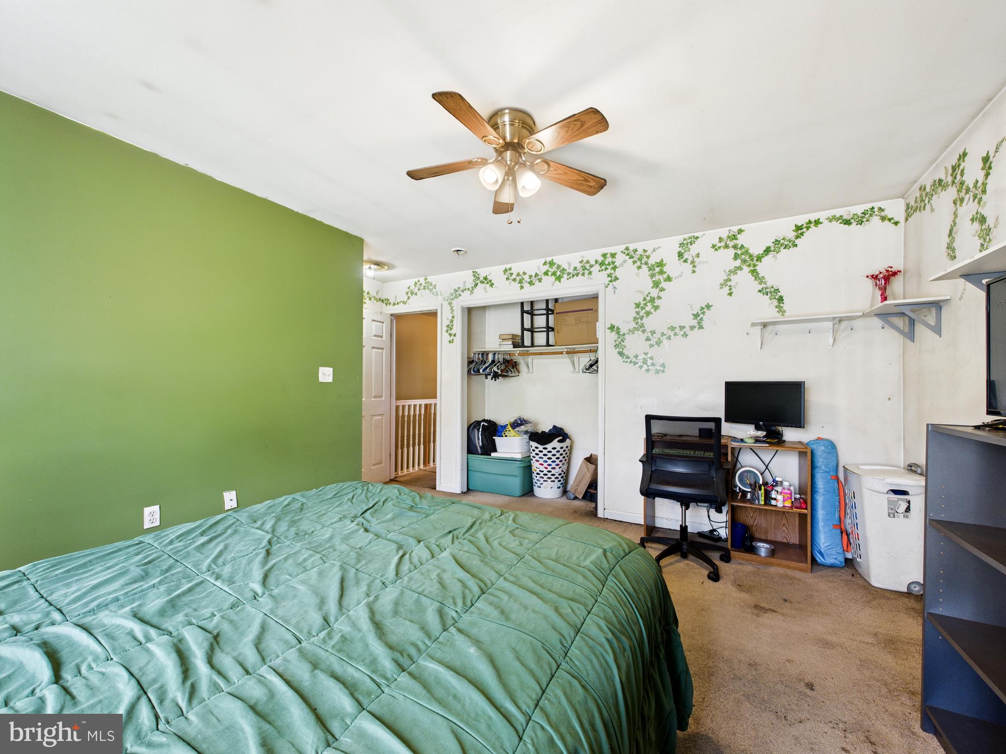 1176 West 6th Street Laurel, DE 19956 - Photo 11 of 42 a bedroom with a bed and a desk