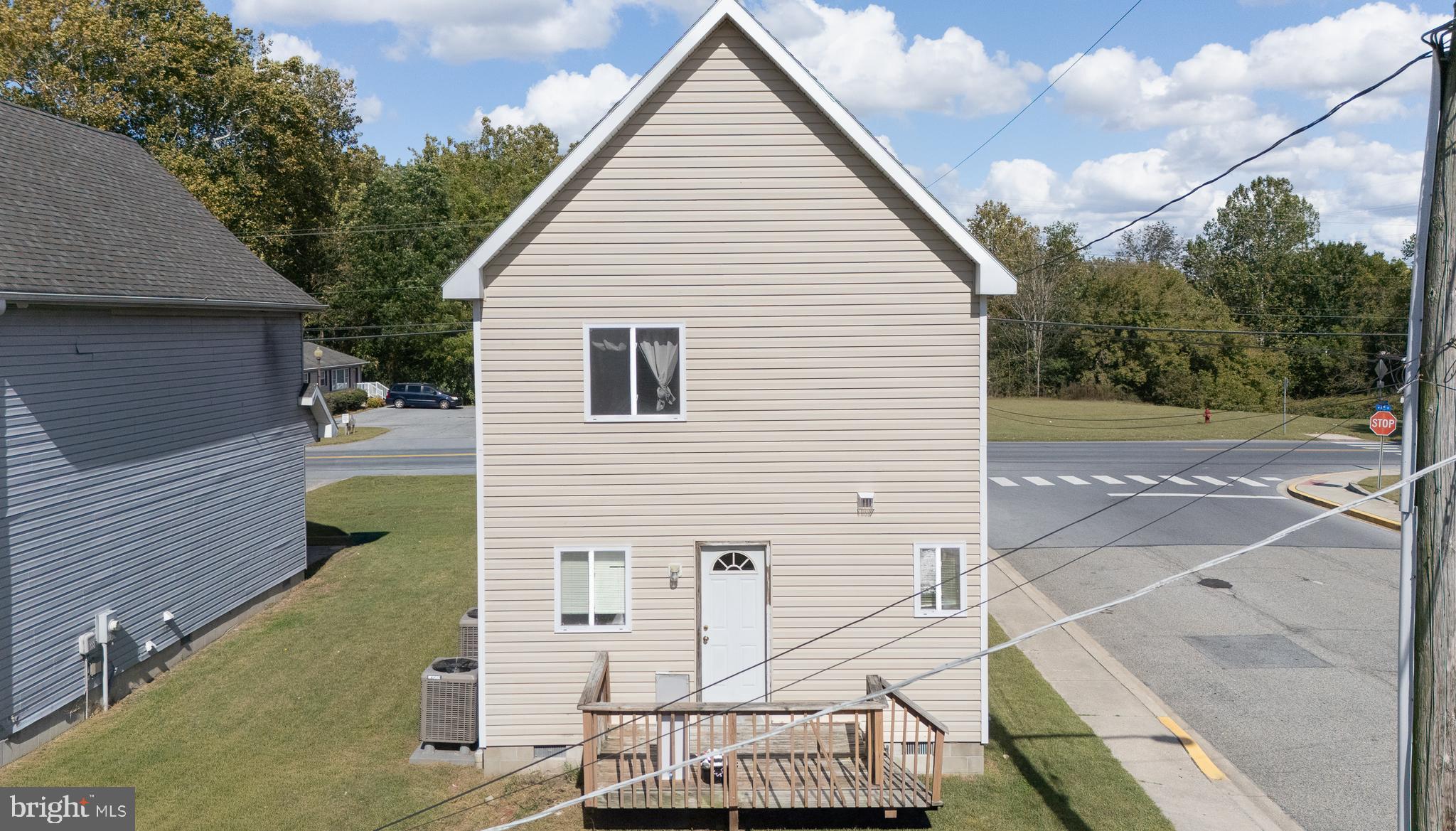 1176 West 6th Street Laurel, DE 19956 - Photo 5 of 42 a view of a white house with a yard
