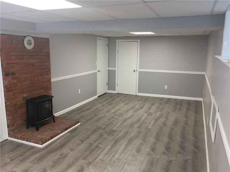 70 Robinhood Road Pittsburgh, PA 15220 - Photo 17 of 25 Lower level Family Room 23x11 w/ new electric heater