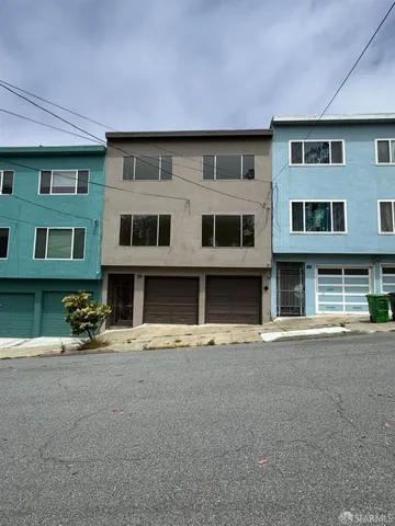 a front view of building with street