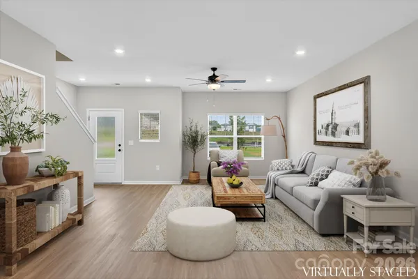 a living room with furniture and a large window