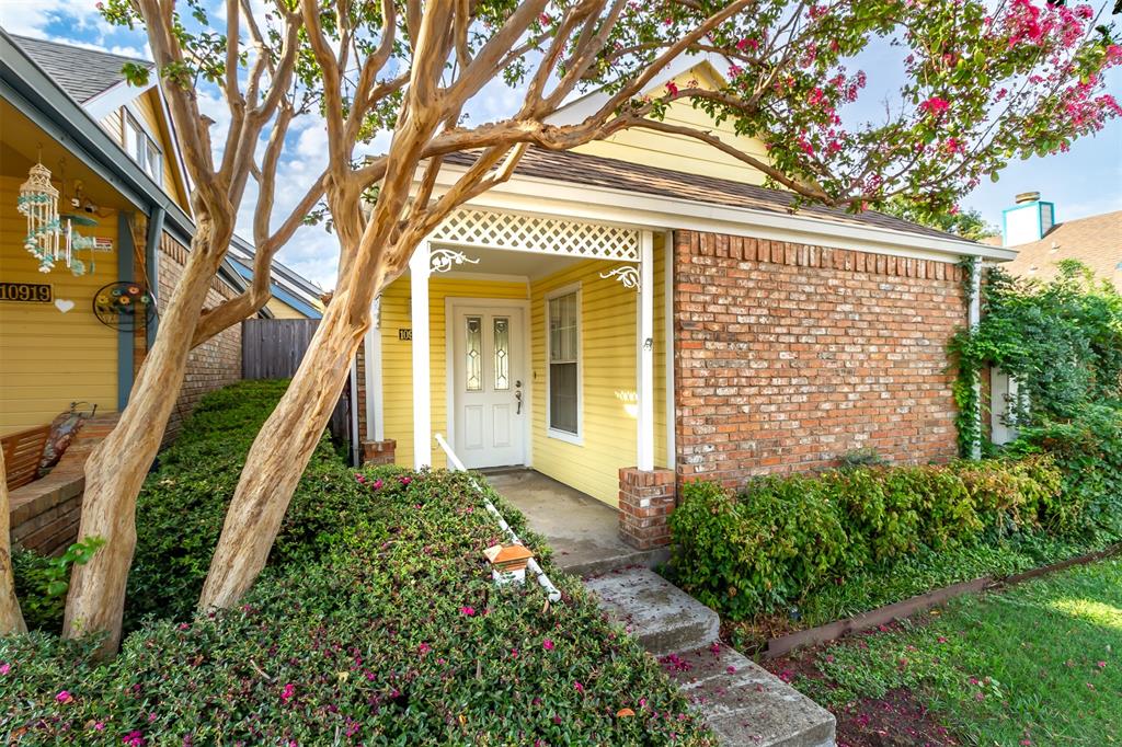 a view of a house with a tree
