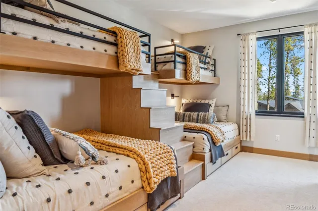 a bedroom with bed and a window