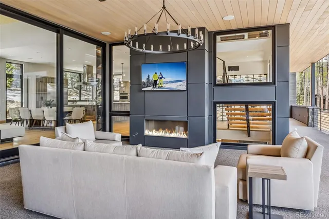 a living room with furniture a window and a fireplace