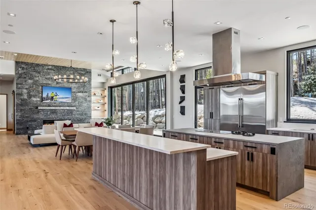 a kitchen with stainless steel appliances granite countertop a stove a sink dishwasher and a wooden cabinets