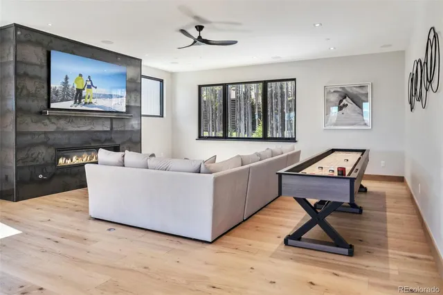 a living room with furniture and painting on the wall