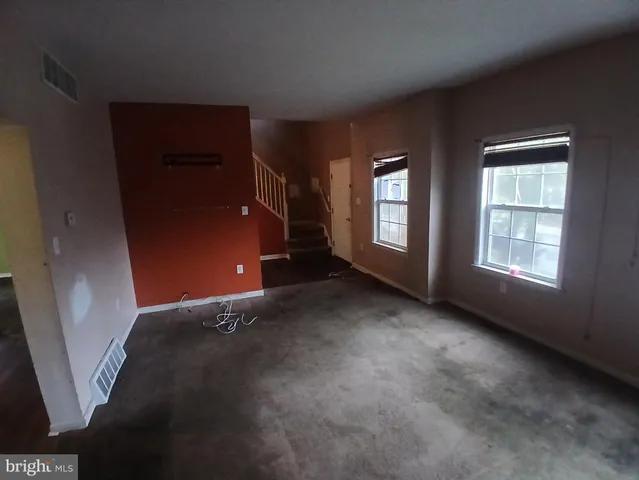 an empty room with windows