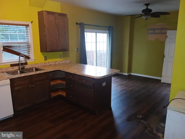 a room with wooden floor and a sink