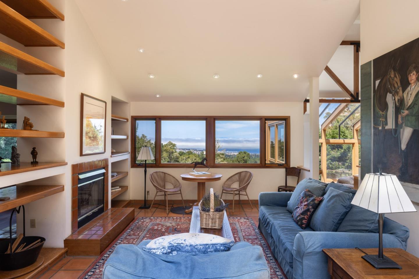 540 Aguajito Road Carmel, CA 93923 - Photo 15 of 32 a living room with furniture fireplace and a large window