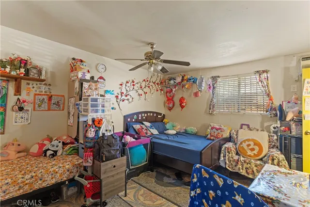 a bedroom with furniture a rug and a window