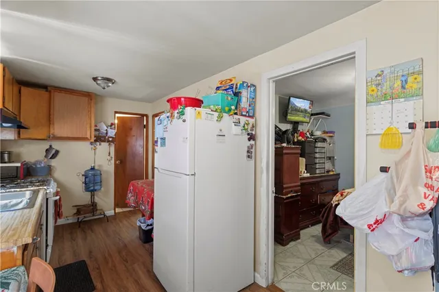 a white refrigerator freezer sitting inside of a kitchen