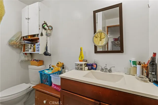 a bathroom with a toilet and a shower curtain