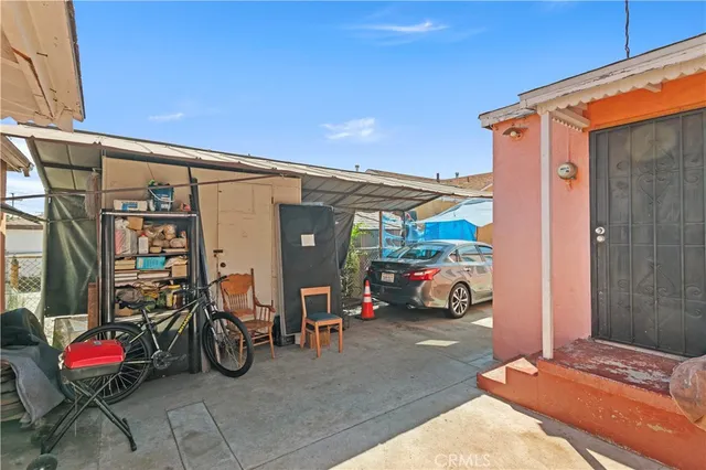 a front view of a house with outdoor seating