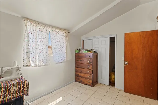 a view of room with closet and cabinet
