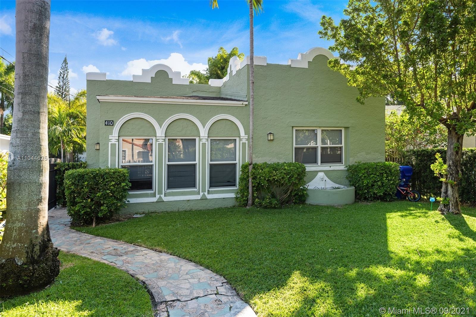 410 Southwest 22nd Road Miami, FL 33129 - Photo 1 of 37 a front view of a house with garden