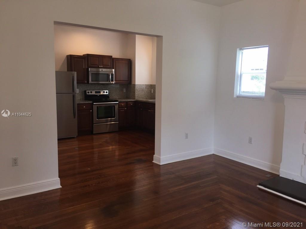 410 Southwest 22nd Road Miami, FL 33129 - Photo 13 of 37 a view of kitchen with wooden floor and electronic appliances