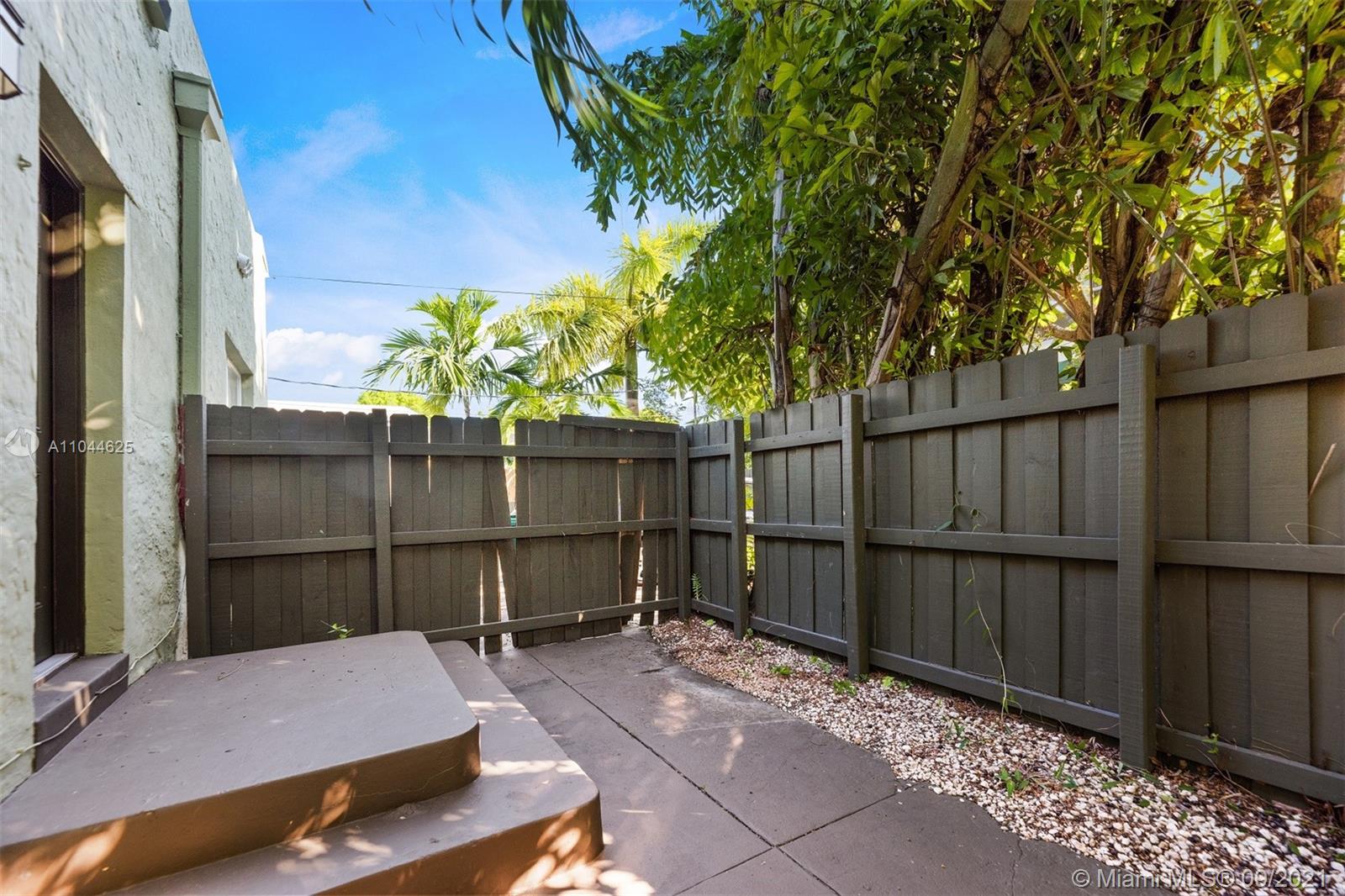 410 Southwest 22nd Road Miami, FL 33129 - Photo 21 of 37 a view of a backyard with wooden fence
