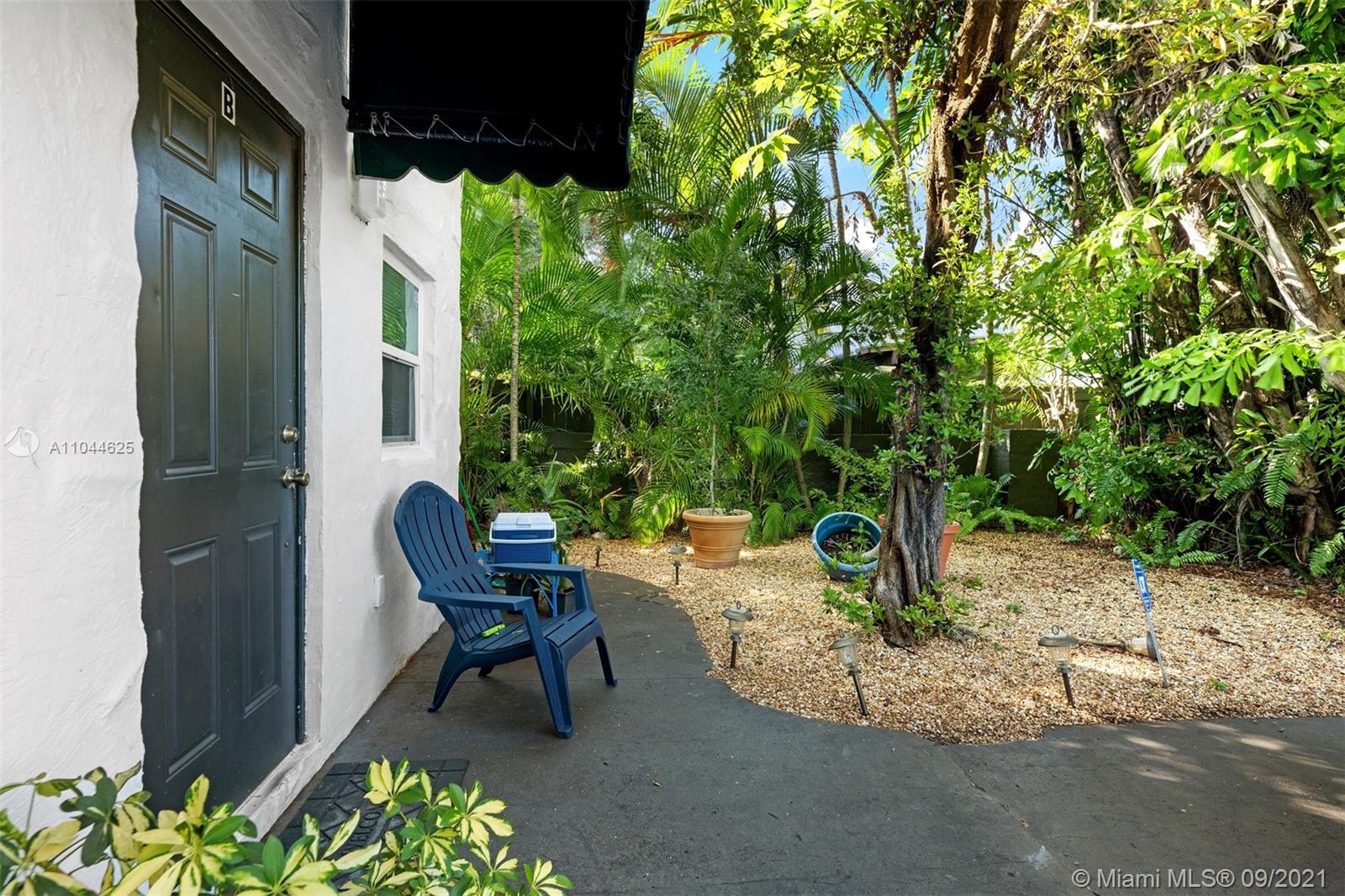 410 Southwest 22nd Road Miami, FL 33129 - Photo 23 of 37 a view of a chairs and table in a backyard