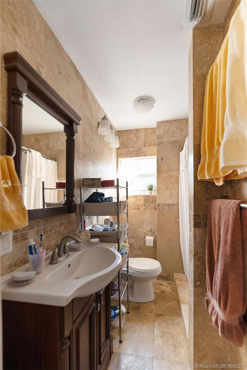 410 Southwest 22nd Road Miami, FL 33129 - Photo 27 of 37 a bathroom with a sink toilet and shower