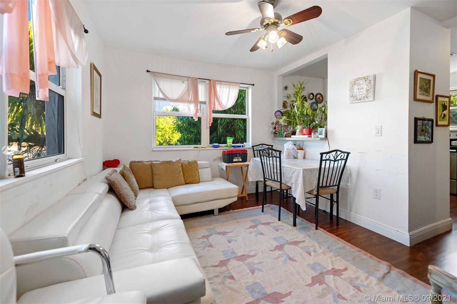 410 Southwest 22nd Road Miami, FL 33129 - Photo 29 of 37 a living room with furniture and a potted plant