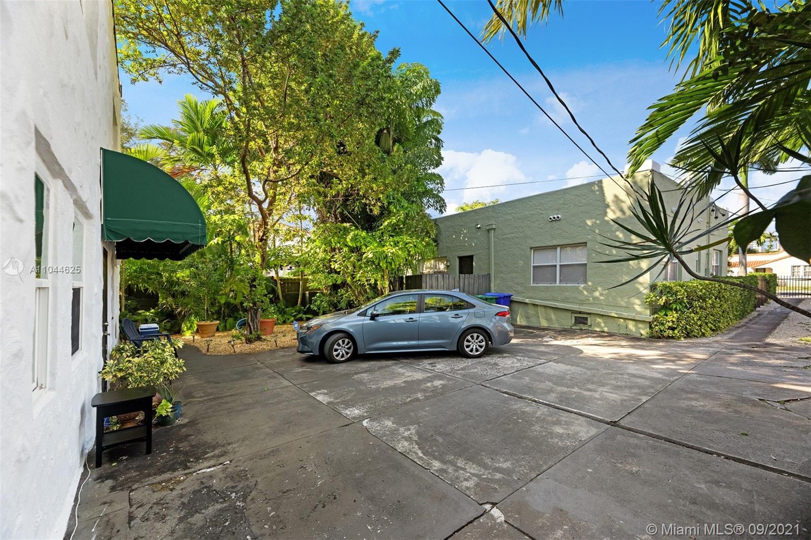 410 Southwest 22nd Road Miami, FL 33129 - Photo 8 of 37 a view of a car parked front of a house