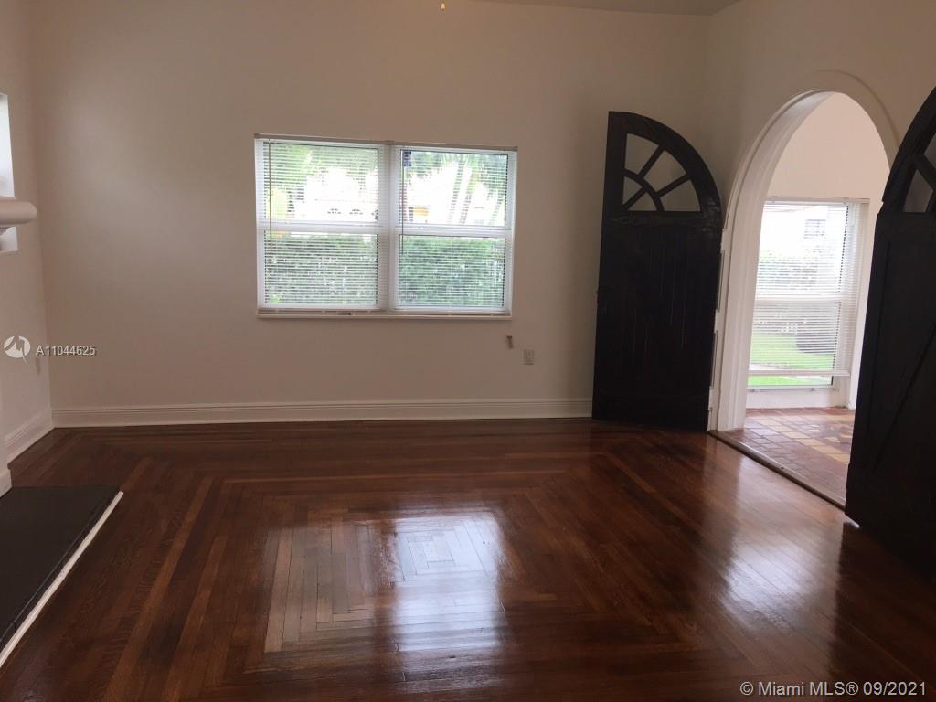 410 Southwest 22nd Road Miami, FL 33129 - Photo 10 of 37 an empty room with wooden floor and windows
