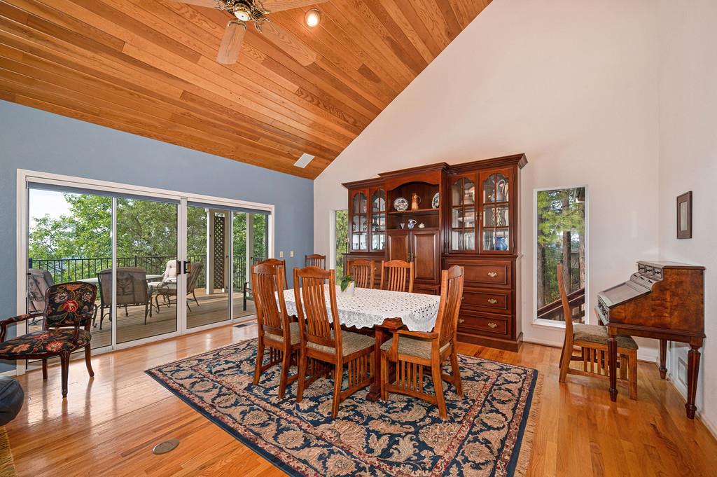 2358 Deer Ravine Court Cool, CA 95614 - Photo 11 of 63 dining area featuring light wood-type flooring, a ceiling fan, and a vaulted wooden ceiling