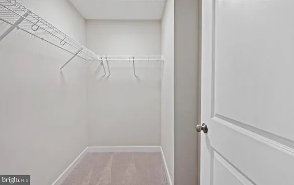 a bathroom with a double vanity sink and mirror