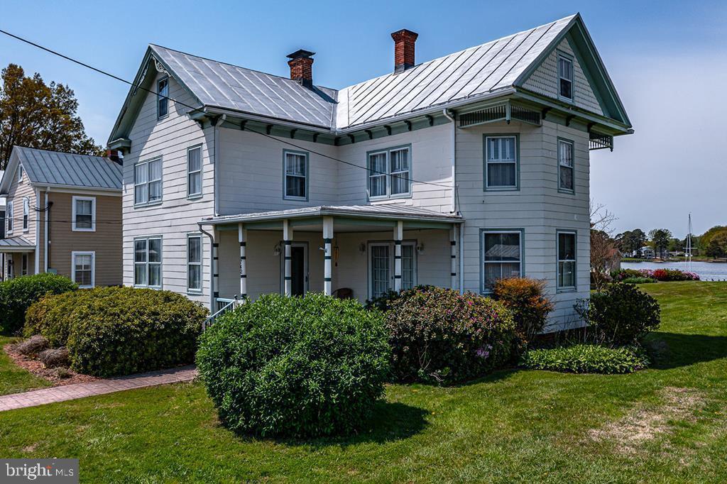 742 Main Street Reedville, VA 22539 - Photo 59 of 66 Charming two-story home with greenery.
