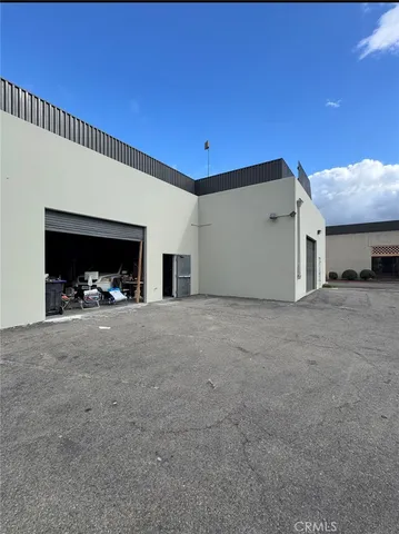 a view of empty room with closet and cabinet