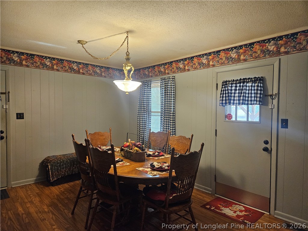 4547 Legion Road Hope Mills, NC 28348 - Photo 13 of 28 a view of a dining room with furniture and wooden floor