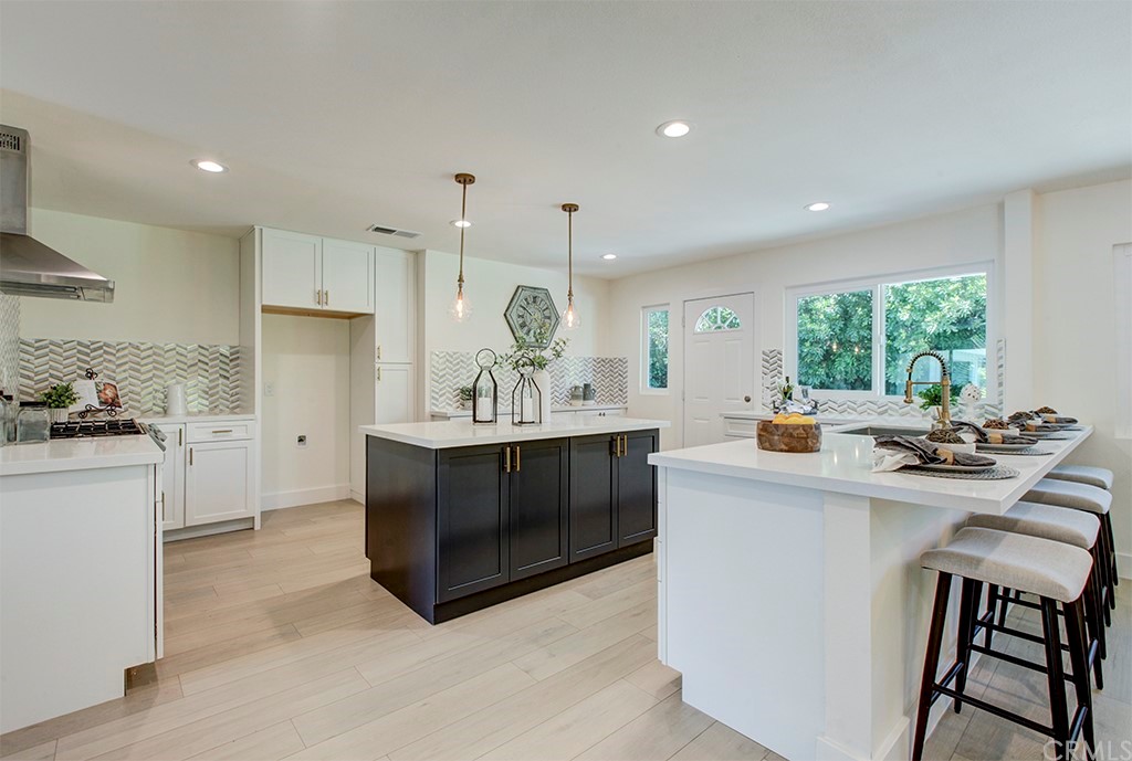 5465 Argyle Way Riverside, CA 92506 - Photo 1 of 1 a kitchen with stainless steel appliances a sink stove and cabinets