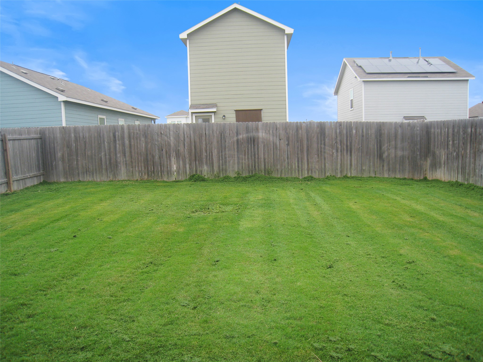 229 Geode Glen Maxwell, TX 78656 - Photo 19 of 19 A generous backyard offers a private, fenced green space perfect for outdoor activities.