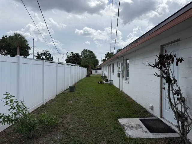 a view of a backyard of the house
