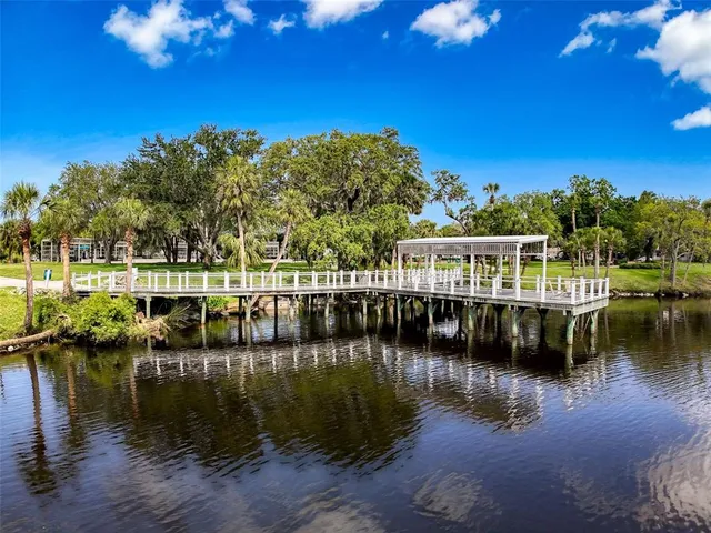 a view of a street with a view of palm trees