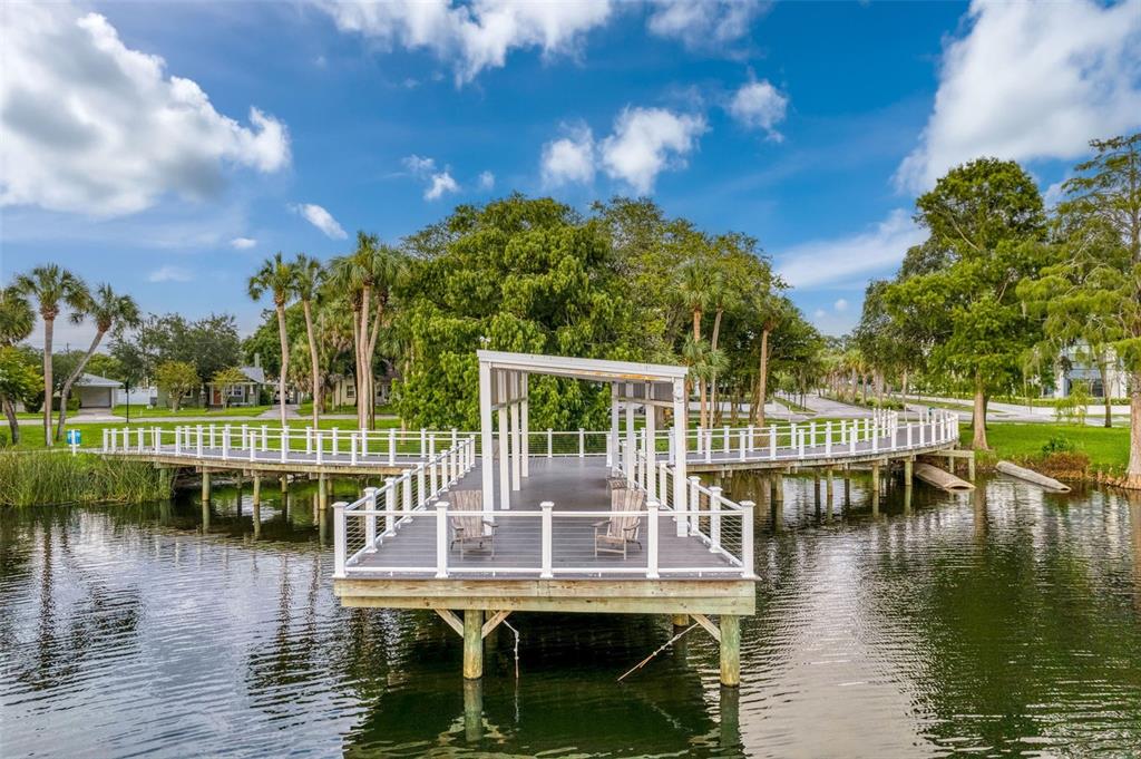 5800 Madison Street New Port Richey, FL 34653 - Photo 48 of 71 a view of a lake with a house in the background