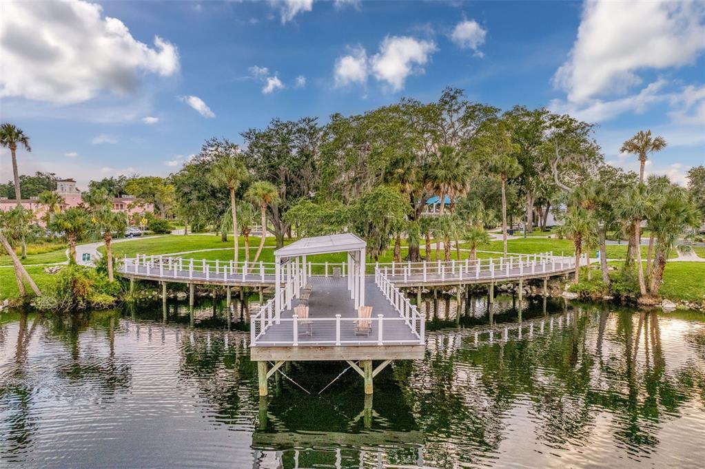 5800 Madison Street New Port Richey, FL 34653 - Photo 49 of 71 a view of a lake with a house and a yard