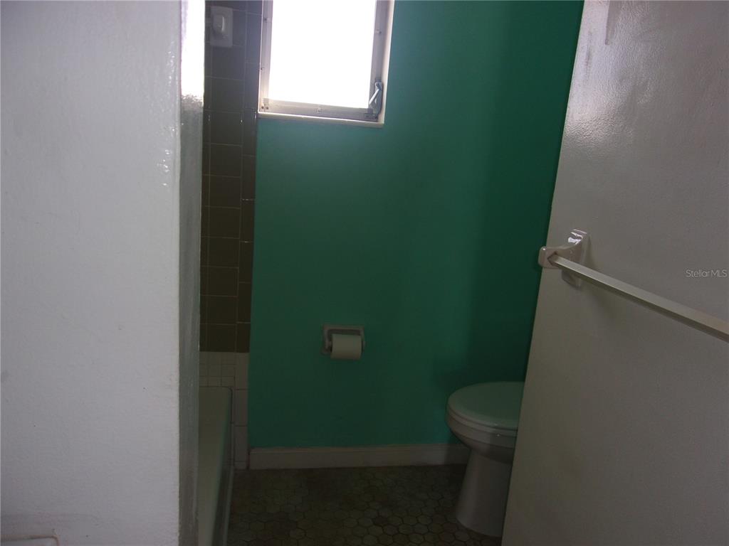 5800 Madison Street New Port Richey, FL 34653 - Photo 77 of 82 a bathroom with a toilet and a sink